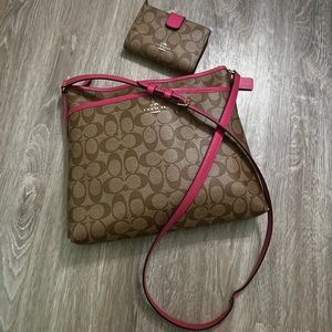 Authentic coach leather crossbody with matching wallet. Pink trim.